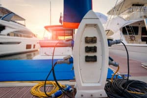 Charging station for boats, electrical outlets to charge ships in harbor.